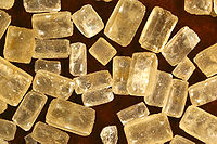 Photo of highly magnified raw sugar crystals